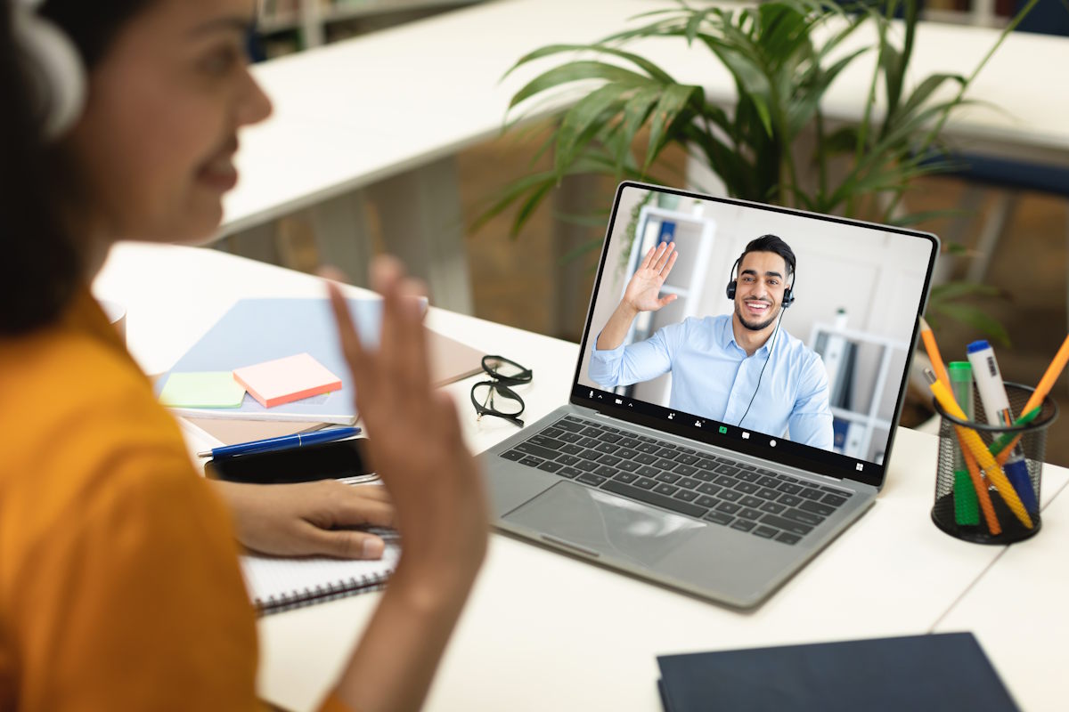 woman-video-calling-with-man-in-a-meeting-2026-01-08-23-20-33-utc - Copy Learner using a laptop for online language learning